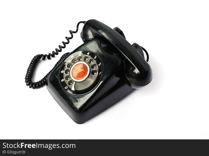 Old telephone on the white background