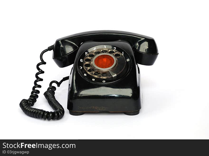 Old telephone on the white background