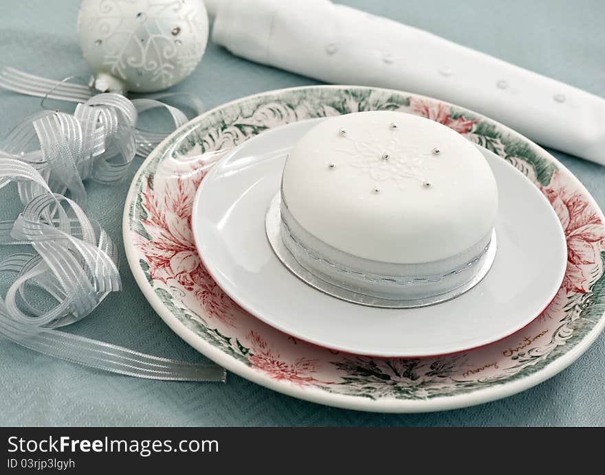 Decorated christmas cake on the blue tablecloth