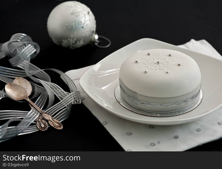 Christmas cake, decorated, on black background