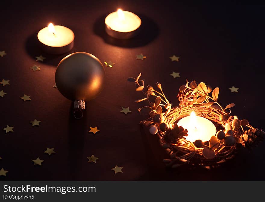 Christmas candles and ball with star confetti