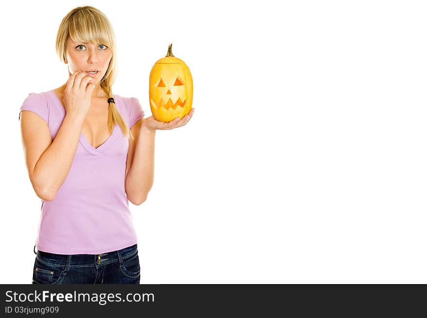 Young woman frightened with pumpkin for Halloween. Lots of copyspace and room for text on this isolate. Young woman frightened with pumpkin for Halloween. Lots of copyspace and room for text on this isolate