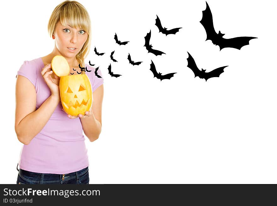 Young woman terrified screams with a pumpkin for Halloween. Lots of copyspace and room for text on this isolate