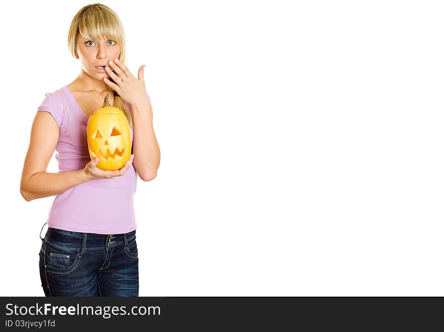 Young woman frightened with pumpkin for Halloween. Lots of copyspace and room for text on this isolate. Young woman frightened with pumpkin for Halloween. Lots of copyspace and room for text on this isolate