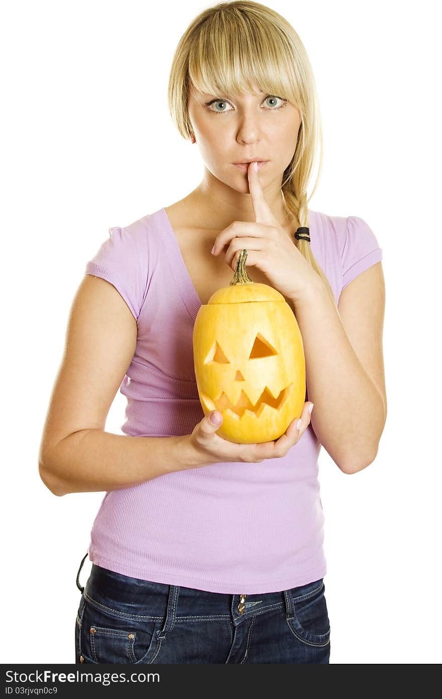 Young woman frightened with pumpkin for Halloween. Gesturing for Quiet or Shushing. Lots of copyspace and room for text on this isolate. Young woman frightened with pumpkin for Halloween. Gesturing for Quiet or Shushing. Lots of copyspace and room for text on this isolate