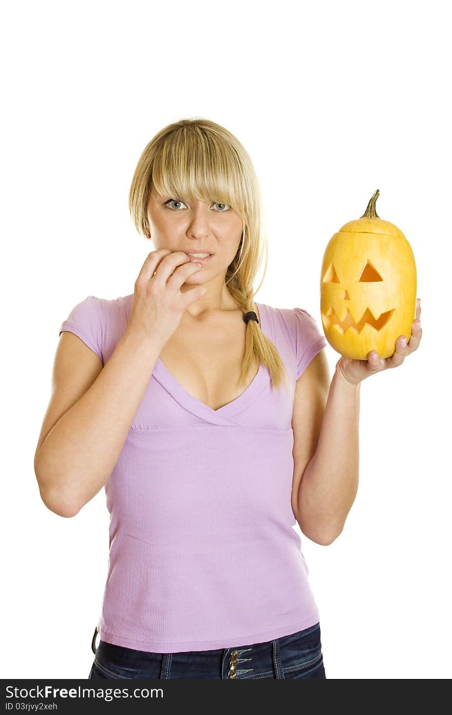 Young woman frightened with pumpkin for Halloween. Lots of copyspace and room for text on this isolate. Young woman frightened with pumpkin for Halloween. Lots of copyspace and room for text on this isolate