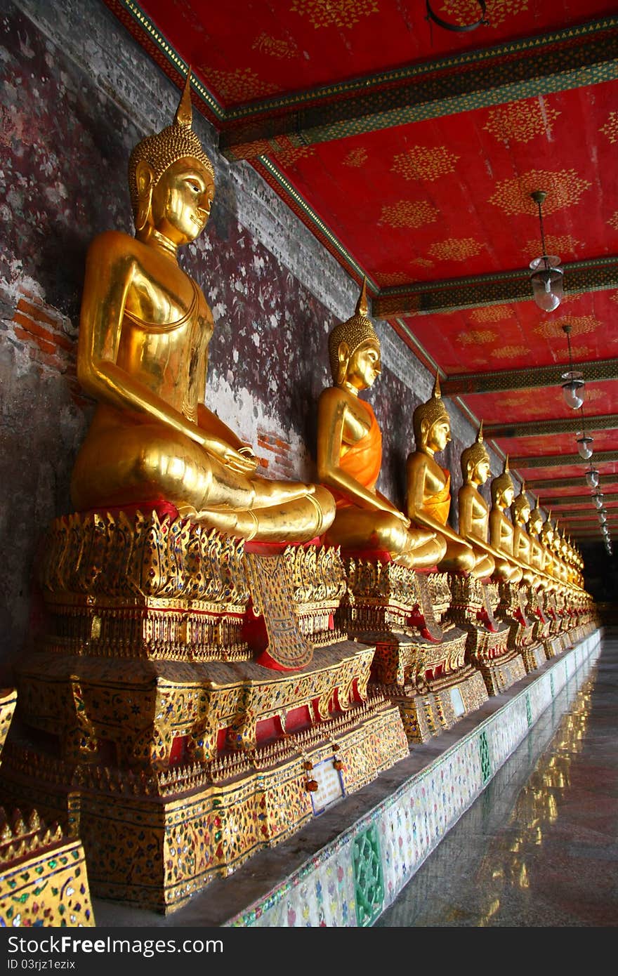 Golden Buddha image at corridor, Wat Suthat temple, Thailand