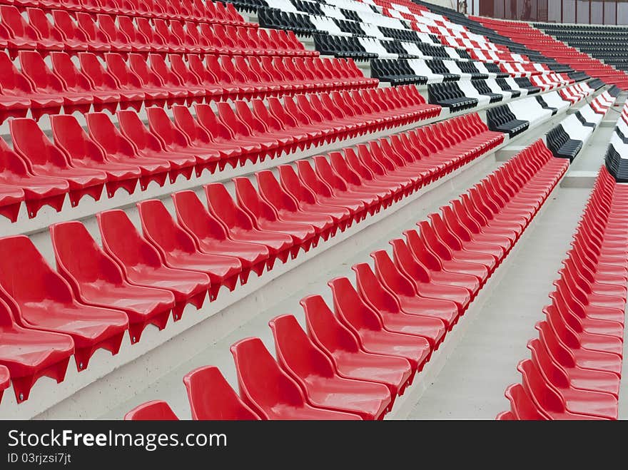 Stadium stands with red, black and white seats. Stadium stands with red, black and white seats