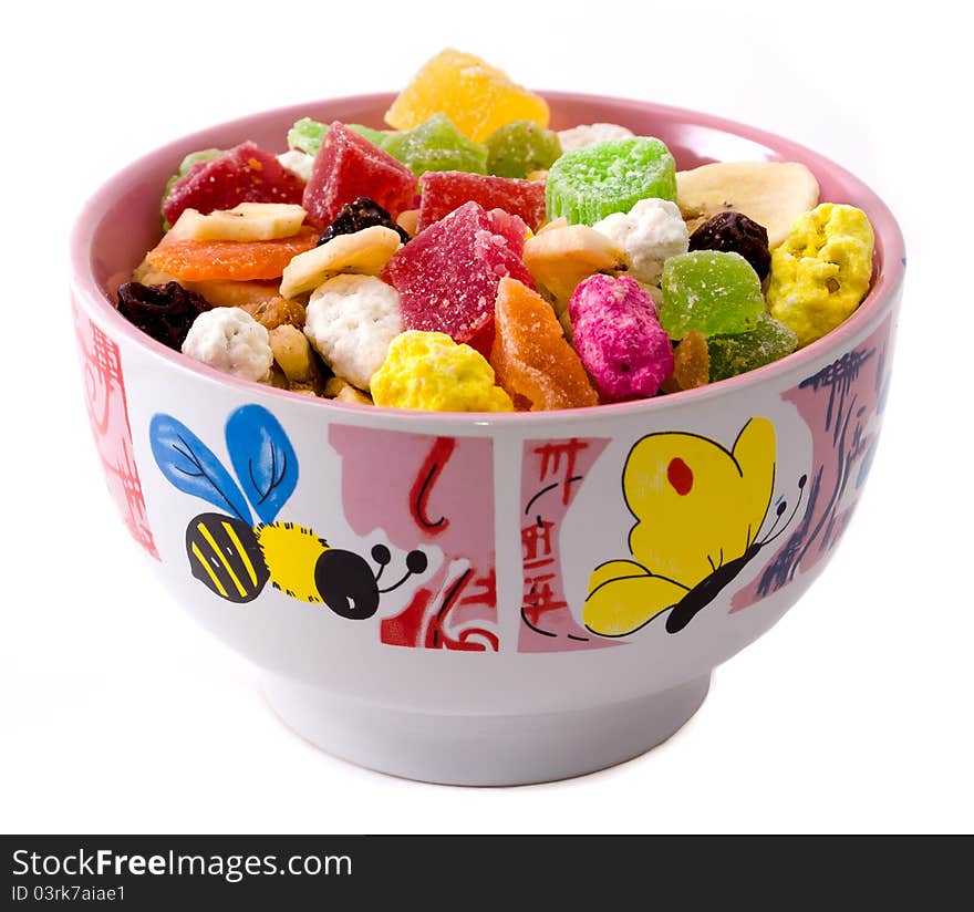 Assorted nuts and dried fruit on a plate. Assorted nuts and dried fruit on a plate