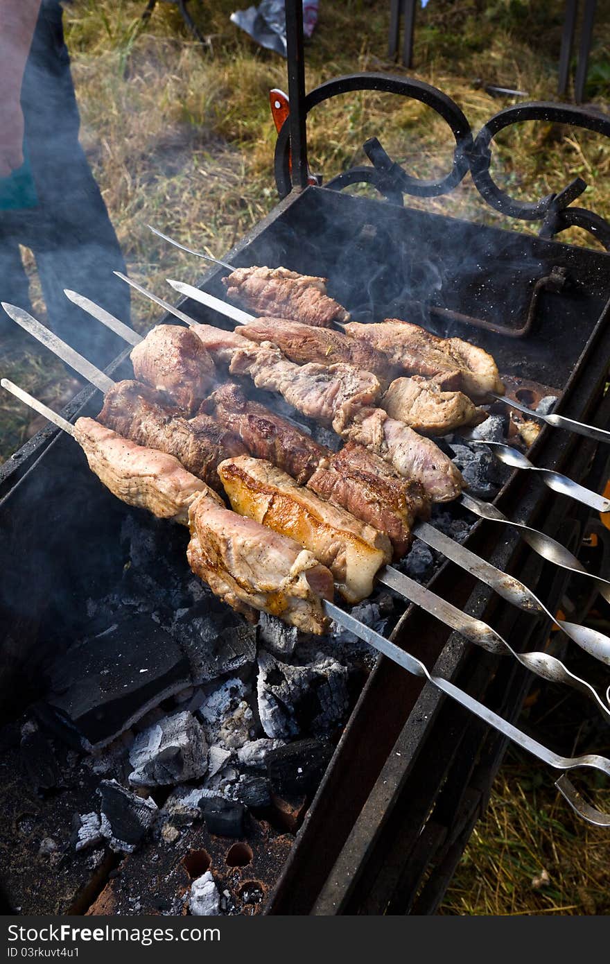 Appetizing pieces of meat shish kebab on metal skewers. Appetizing pieces of meat shish kebab on metal skewers