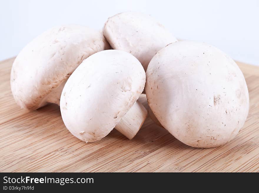 Field Mushrooms On A Wooden Board