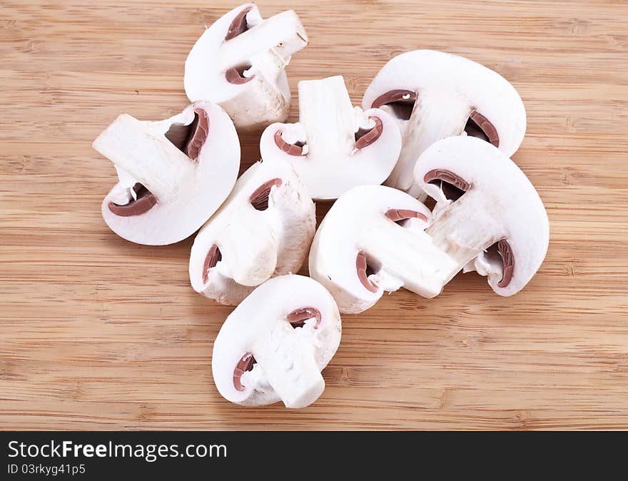 Field mushrooms on a wooden board