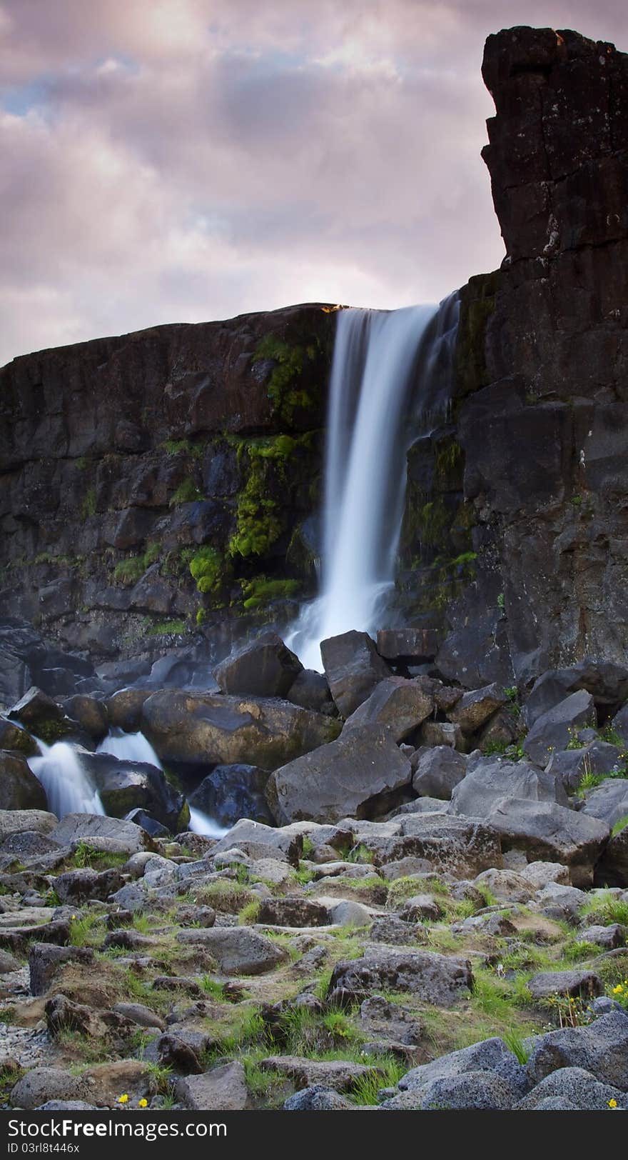 Þingvellir national park near Reykjavik is one of the most popular places of interest along so called Golden Ring - route from Reykjavik. This is where the American and Eurasian plates meet or better to say separate as they are drifting apart creating a canyon. This photo has been taken from below the Öxarárfoss waterfall. Þingvellir national park near Reykjavik is one of the most popular places of interest along so called Golden Ring - route from Reykjavik. This is where the American and Eurasian plates meet or better to say separate as they are drifting apart creating a canyon. This photo has been taken from below the Öxarárfoss waterfall.