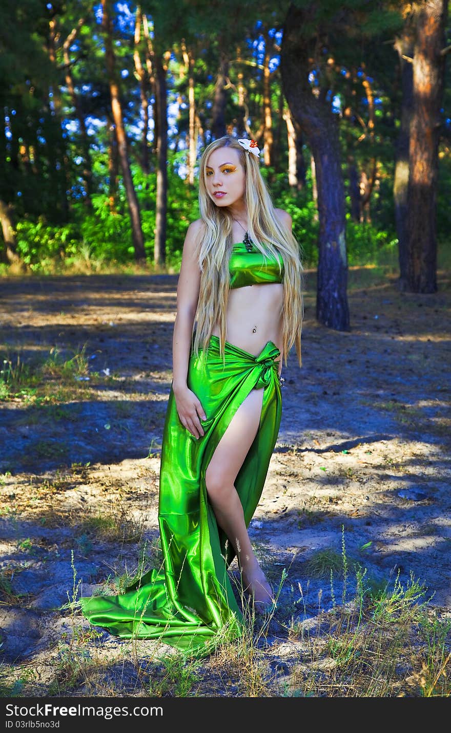 Beautiful romantic woman in forest