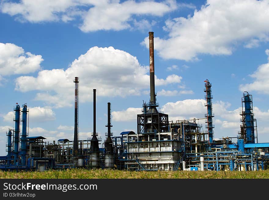 Oil refinery factory against blue sky