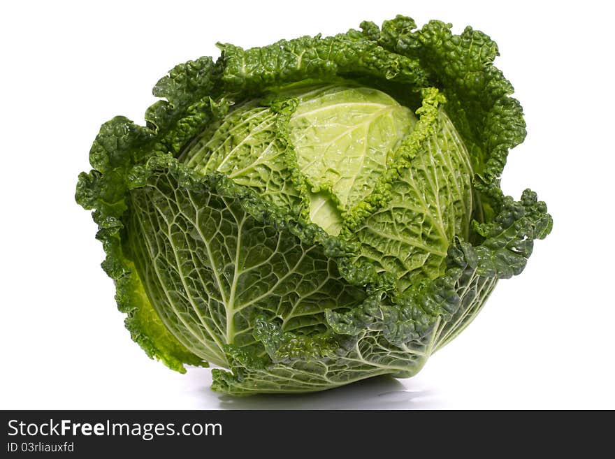 Close up view of a fresh savoy cabbage vegetable isolated on a white background.