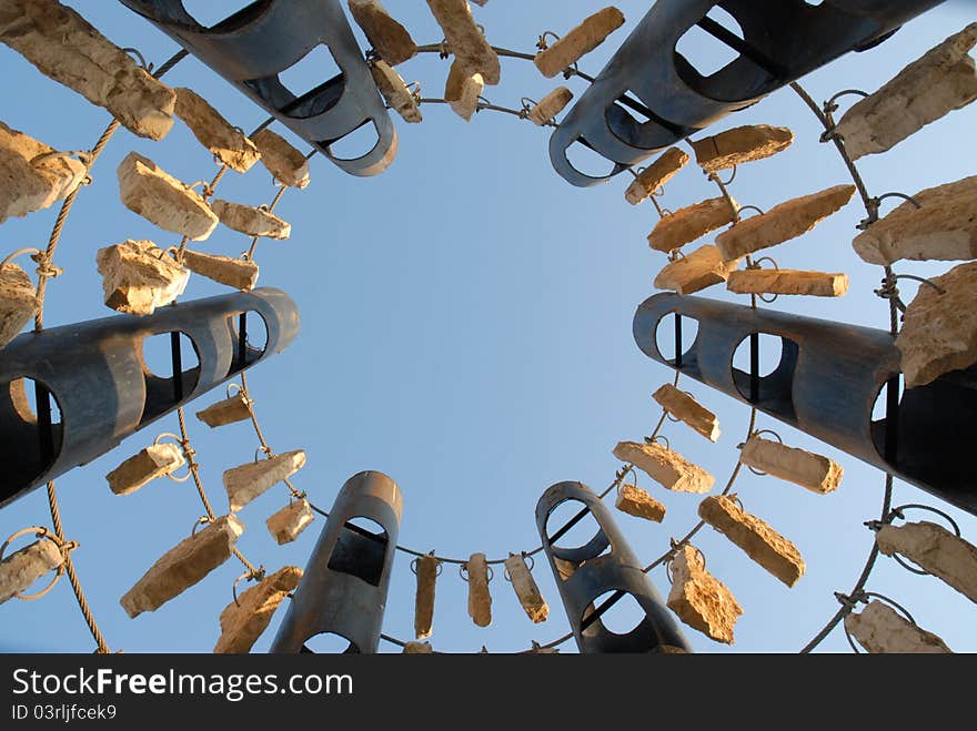 Background of the stones on the pipes hanging in the sky. Background of the stones on the pipes hanging in the sky