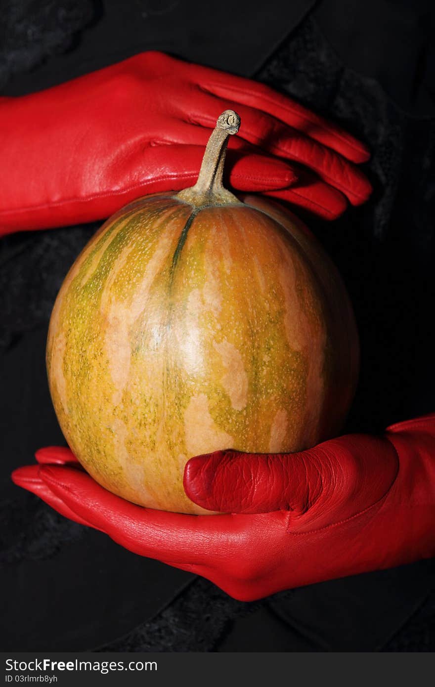 Woman holding halloween pumpkin