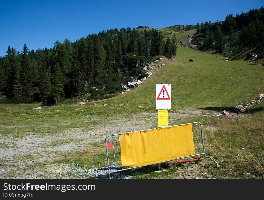 A green ski piste in summer in the mountains of Austria. A green ski piste in summer in the mountains of Austria