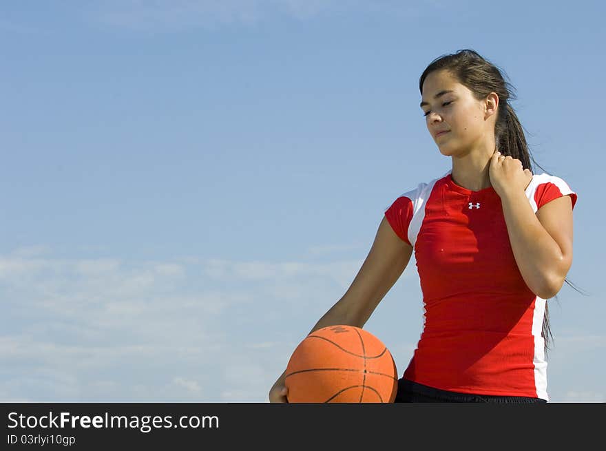 Attractive Female Holding A Basketball