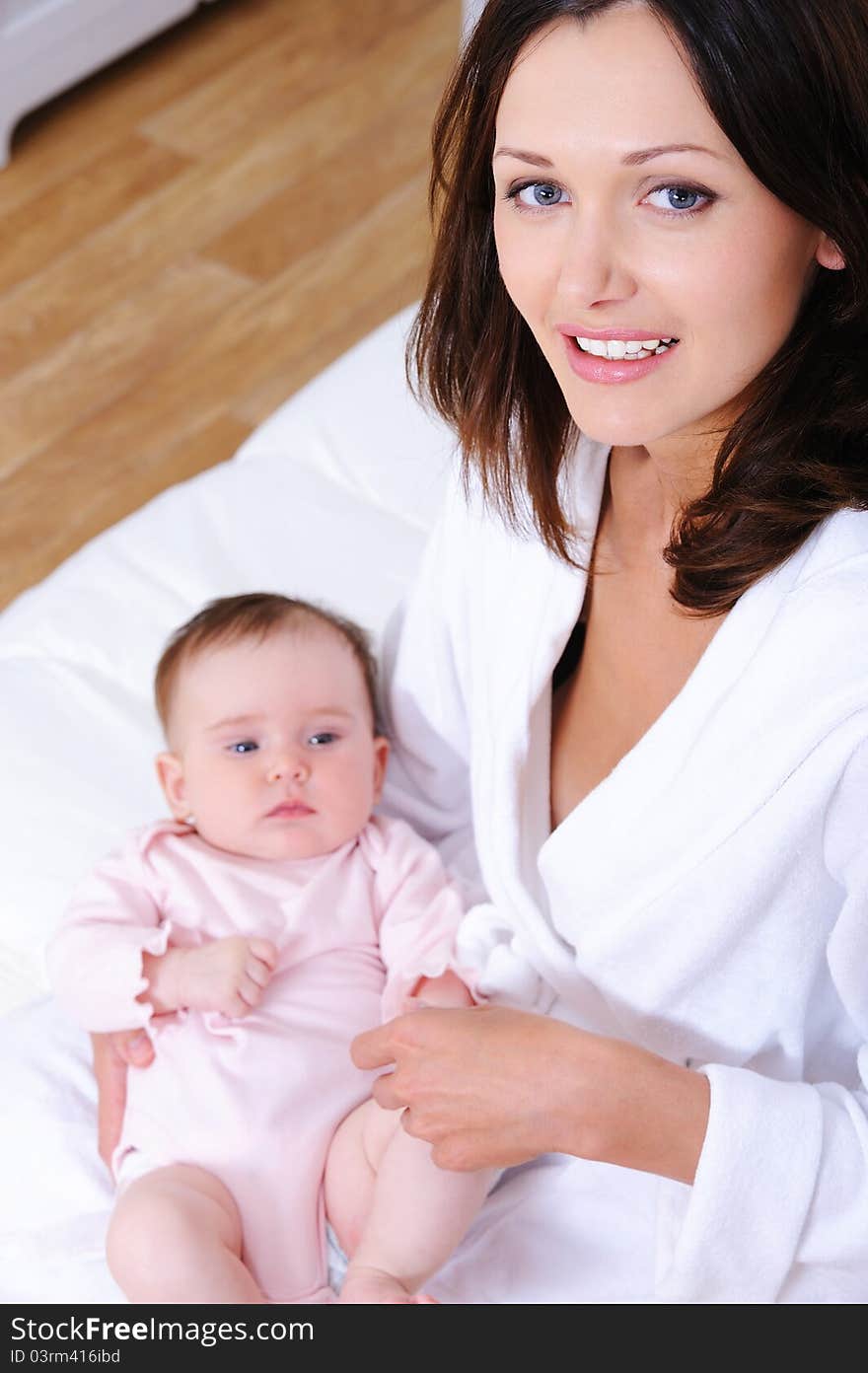 Portrait of happy young beautiful mother with little newborn baby - high angle. Portrait of happy young beautiful mother with little newborn baby - high angle