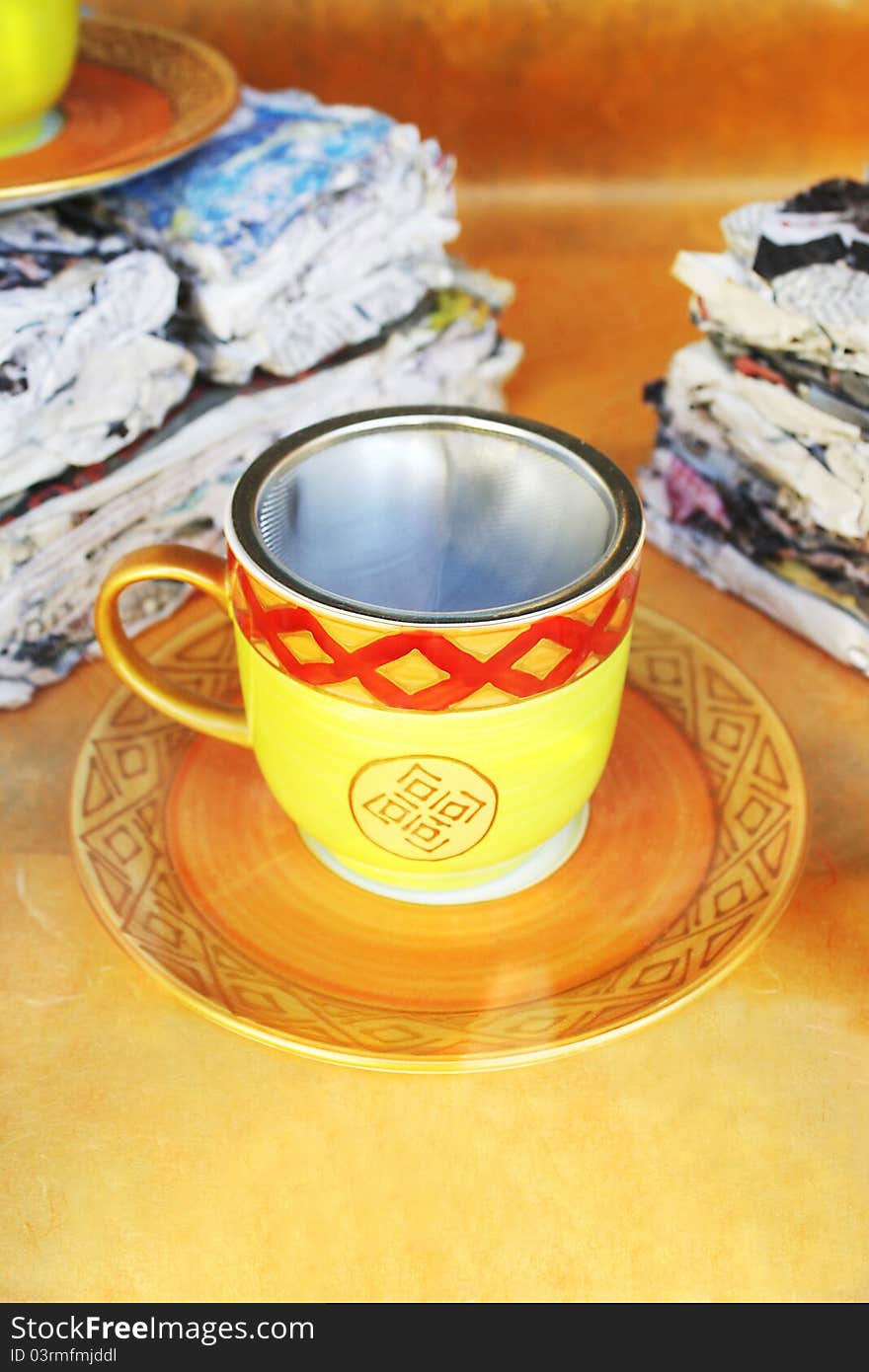 Decorated and colored teacup in the window