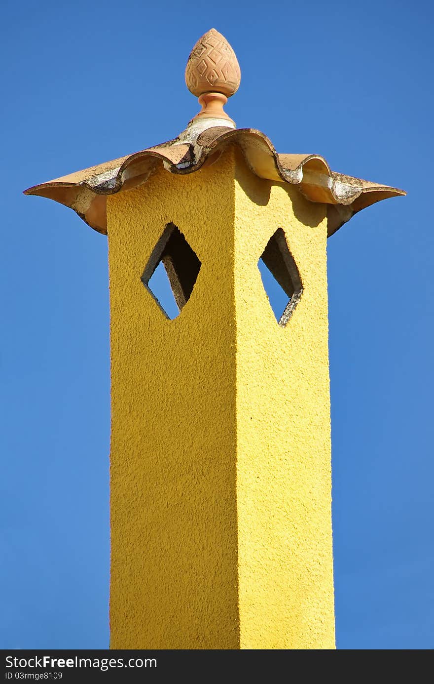 Typical yellow chimney in Majorca (Balearic islands - Spain)