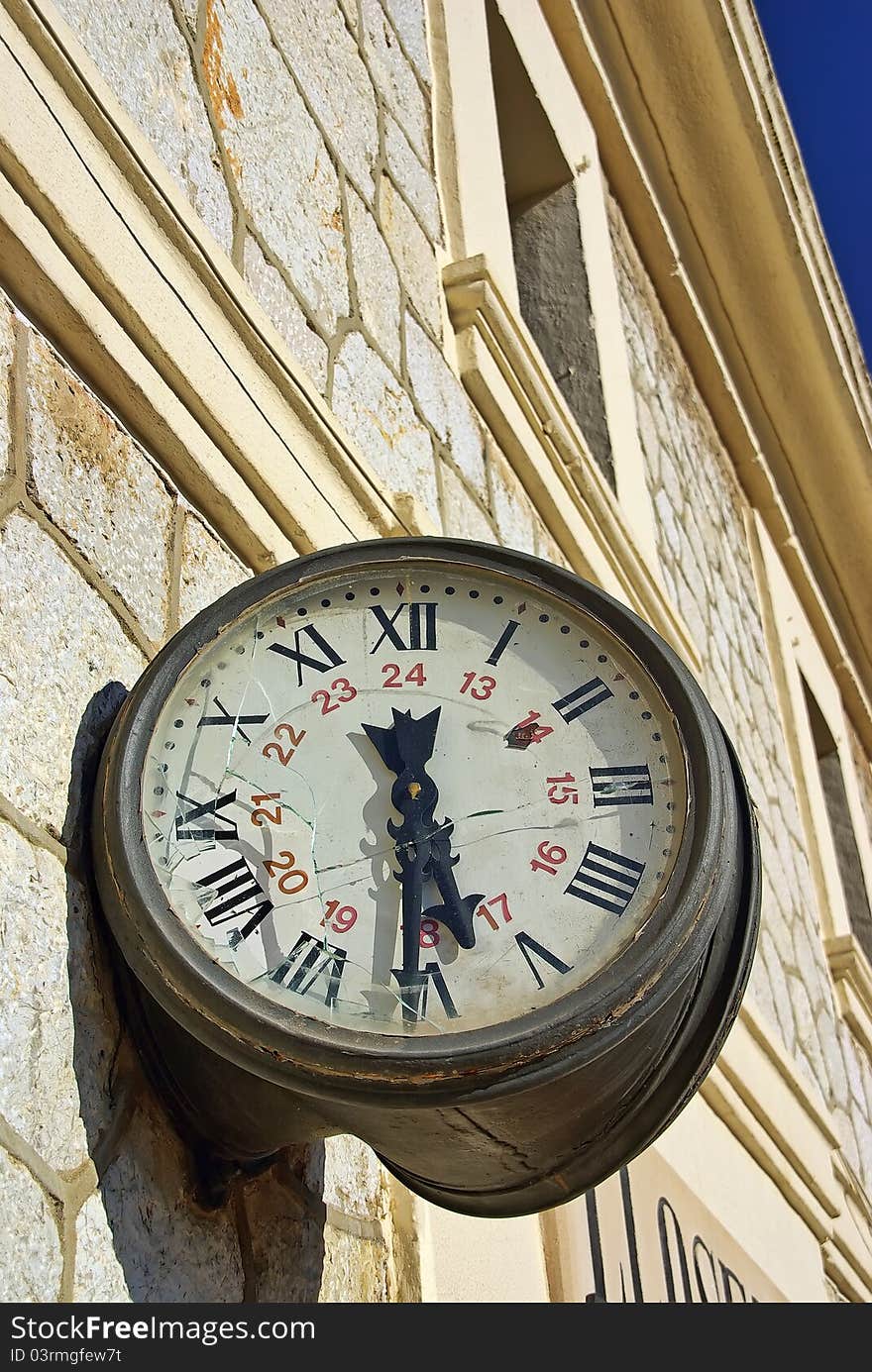 Clock with the glass broken on a rail station. Clock with the glass broken on a rail station