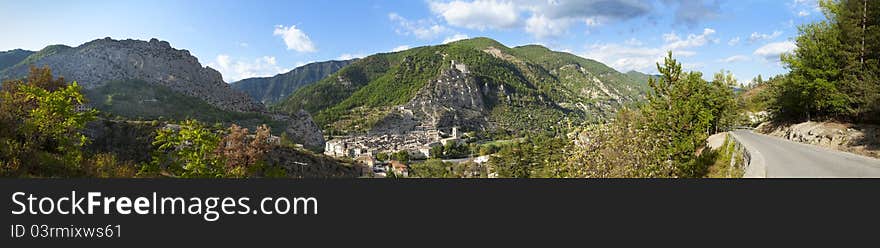 View of Entrevaux at sunset from mountain road. View of Entrevaux at sunset from mountain road.