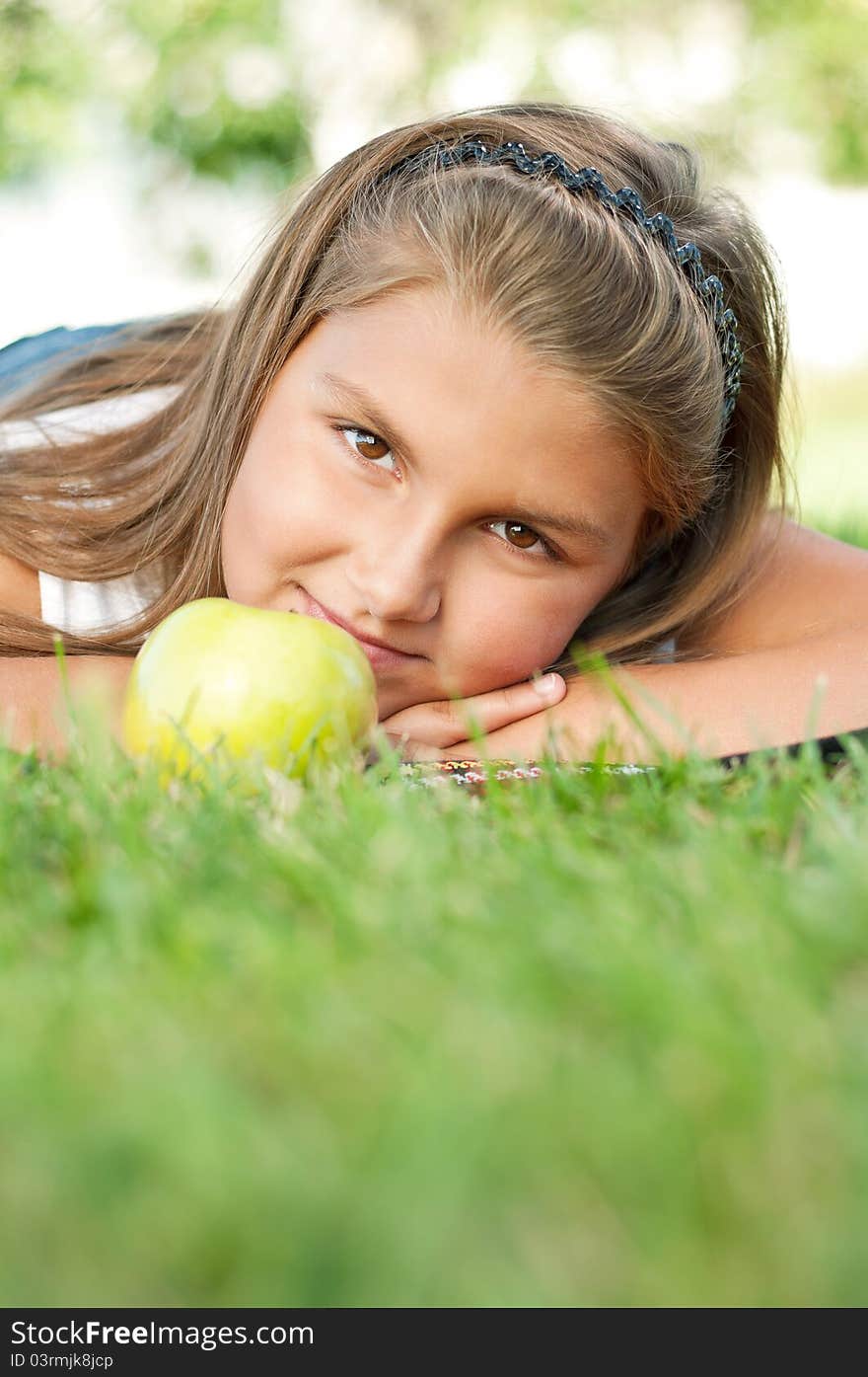 Portrait of little girl with green apple outdoor. Portrait of little girl with green apple outdoor