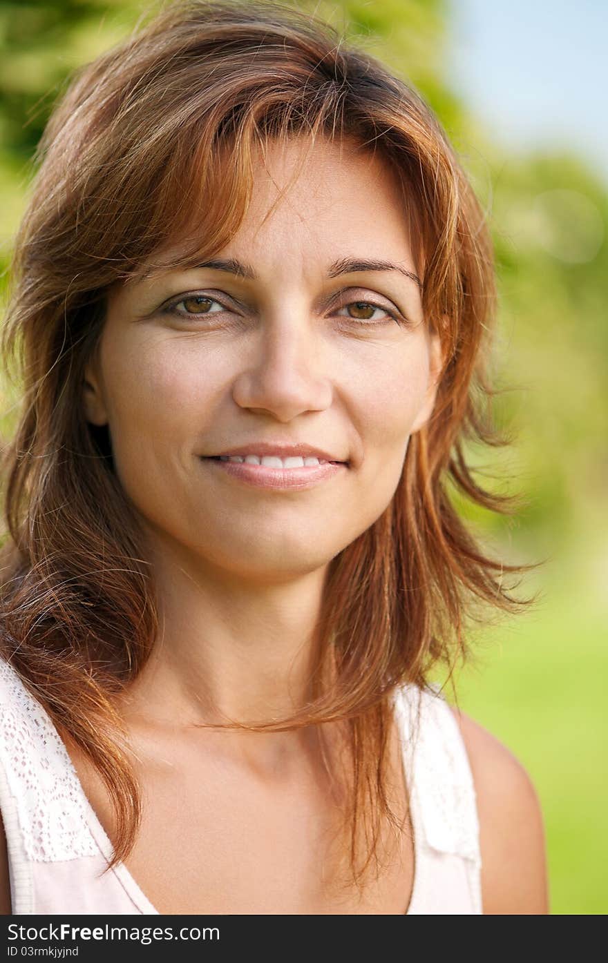 Close up portrait of beautiful caucasian woman in park. Close up portrait of beautiful caucasian woman in park