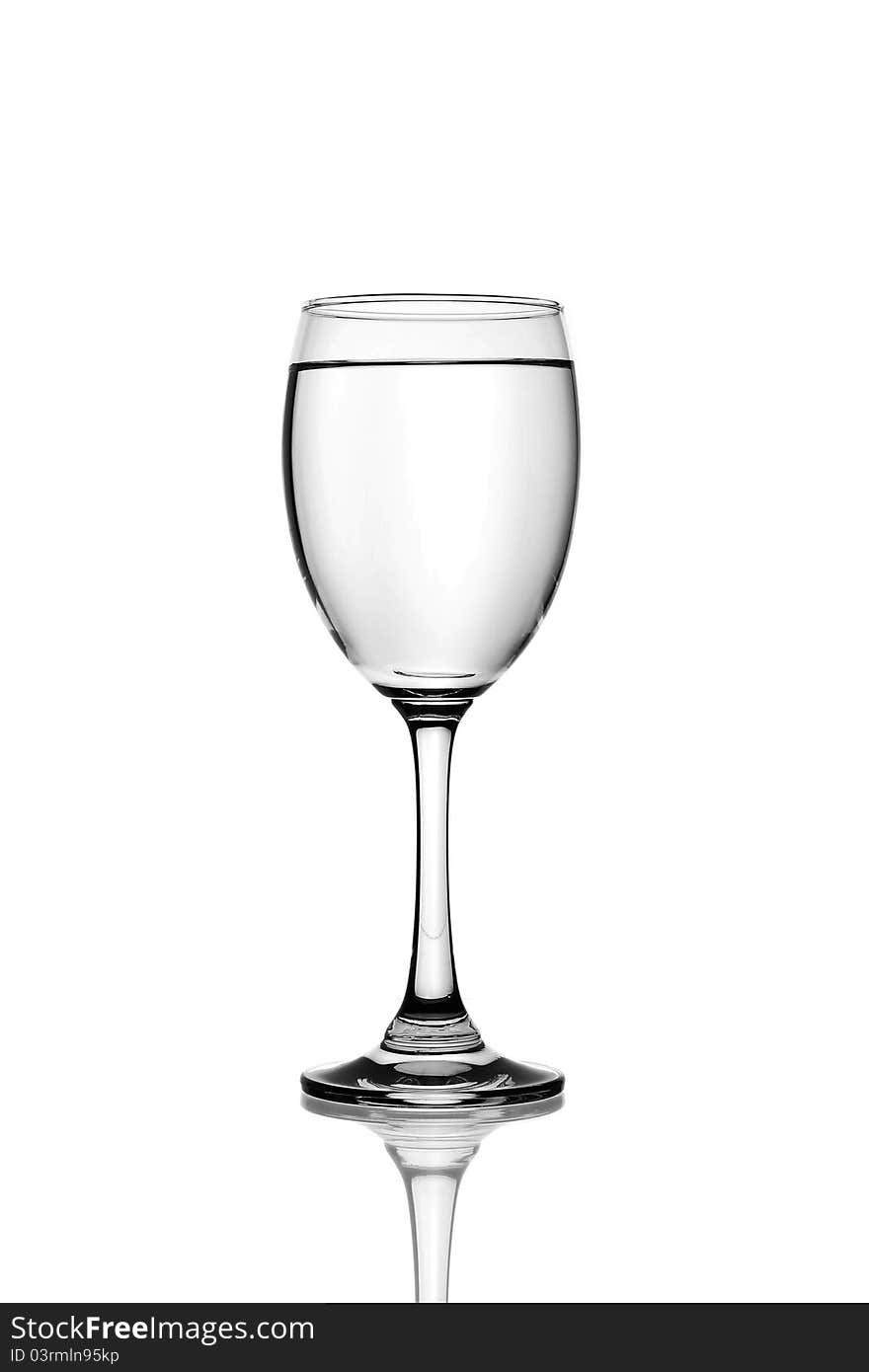 Glass of table-water. Isolated on a white background. Glass of table-water. Isolated on a white background