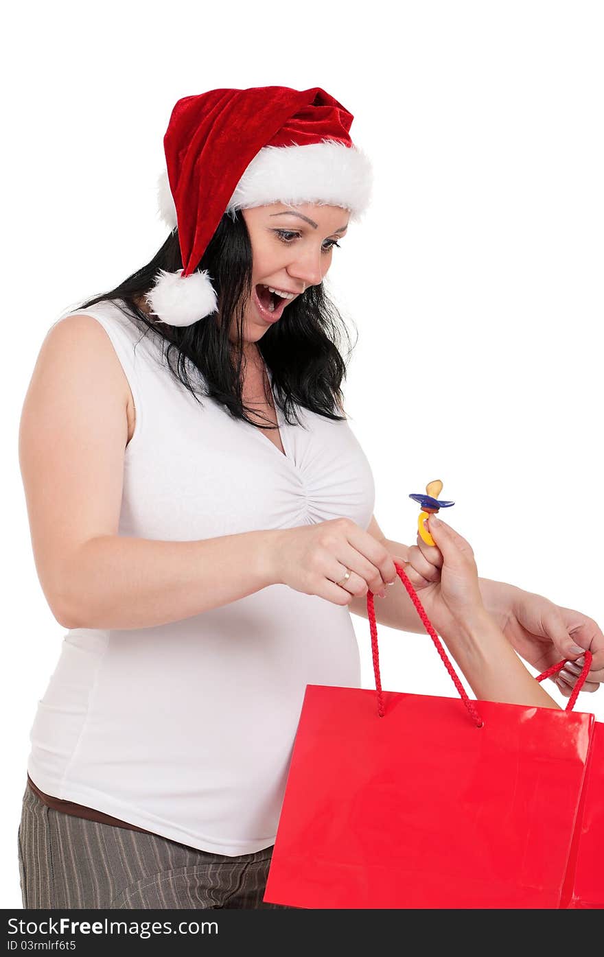 Portrait of a pregnant woman in santa hat holding a shopping bags over white background. Portrait of a pregnant woman in santa hat holding a shopping bags over white background