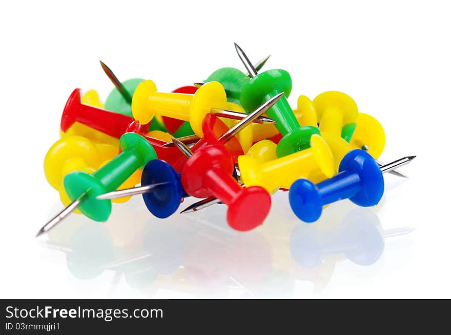 Colorful push pins isolated on white background