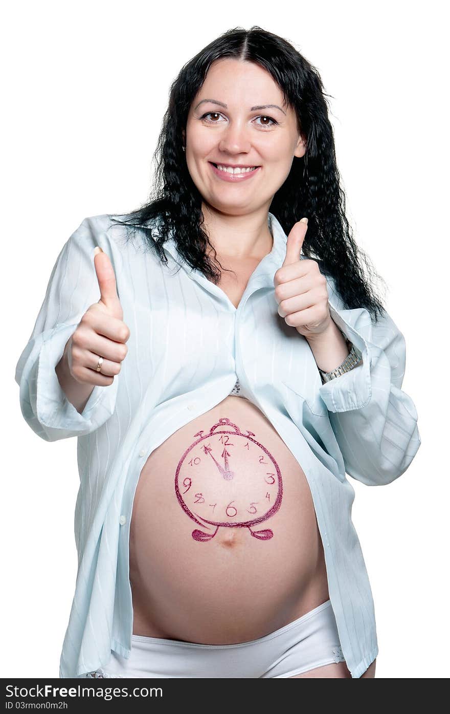 Tummy of pregnant woman with funny drawing over white background. Tummy of pregnant woman with funny drawing over white background