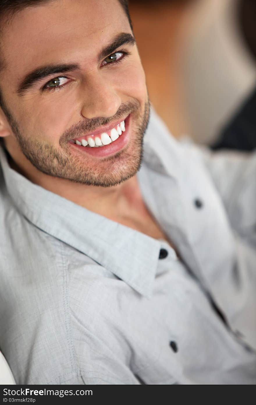 Dark-haired man looking happy