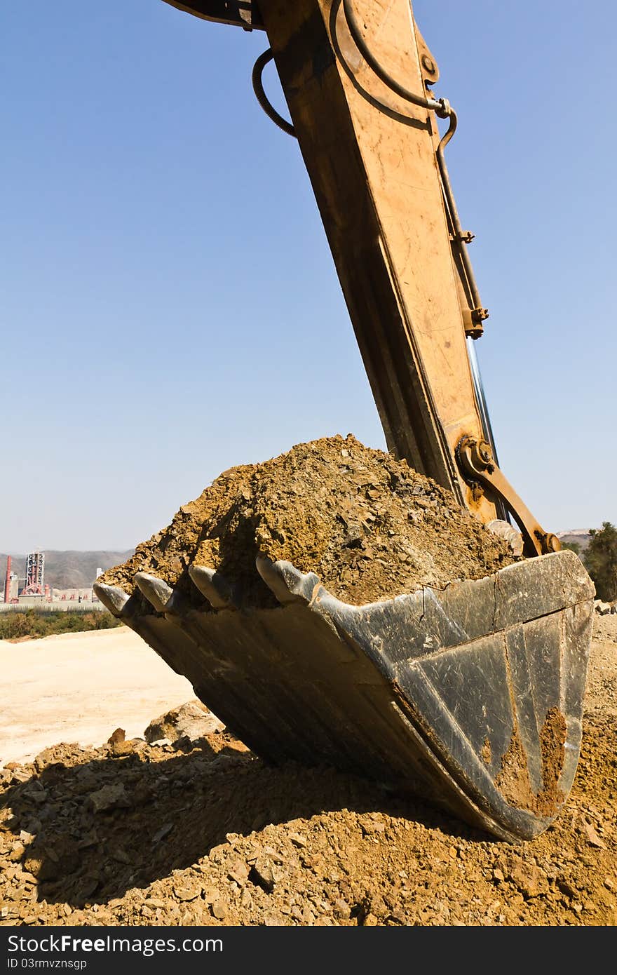 Excavator loader during Earth moving works outdoors  at the quarry