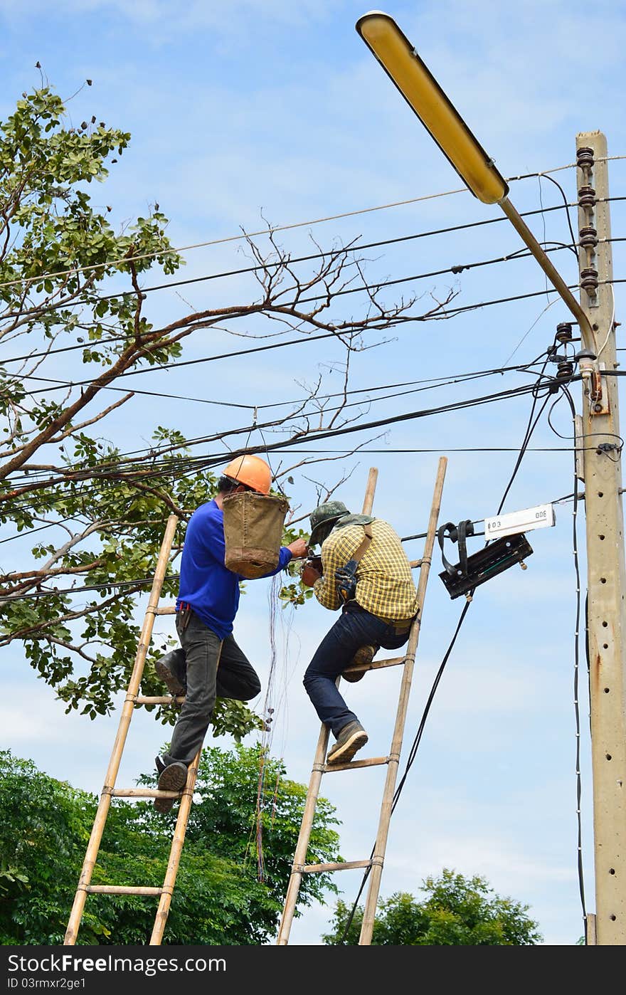 A Lineman Working On Cable