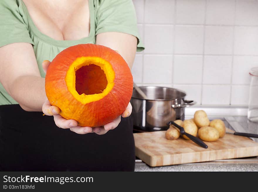 Studio-shot of preparing lunch for the family. cooking hokkaido pumpkin soup in a modern kitchen. Studio-shot of preparing lunch for the family. cooking hokkaido pumpkin soup in a modern kitchen.