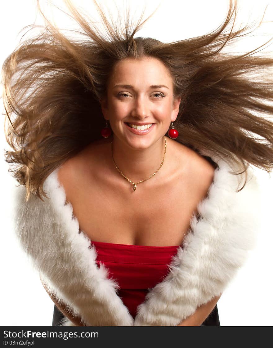 Beautifuleuropean woman in red dress with furs against white backgrounds