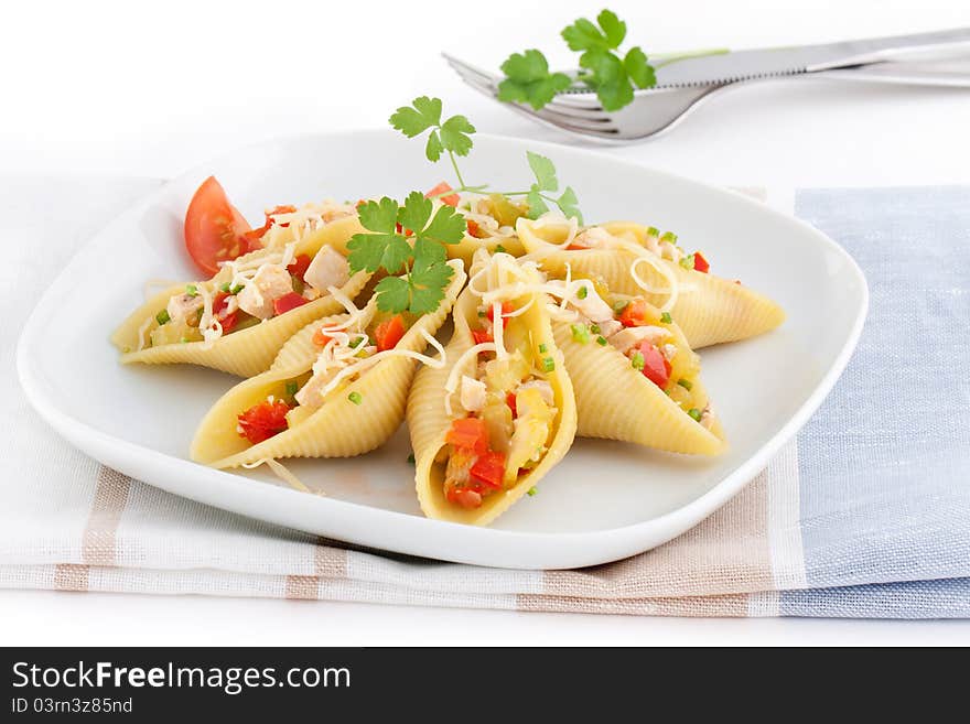 Stuffed conchiglioni with chicken. pepper, celery and cheese