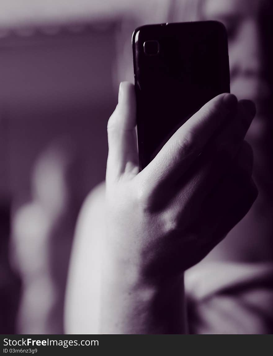 A woman taking a photo herself from her backside. A woman taking a photo herself from her backside