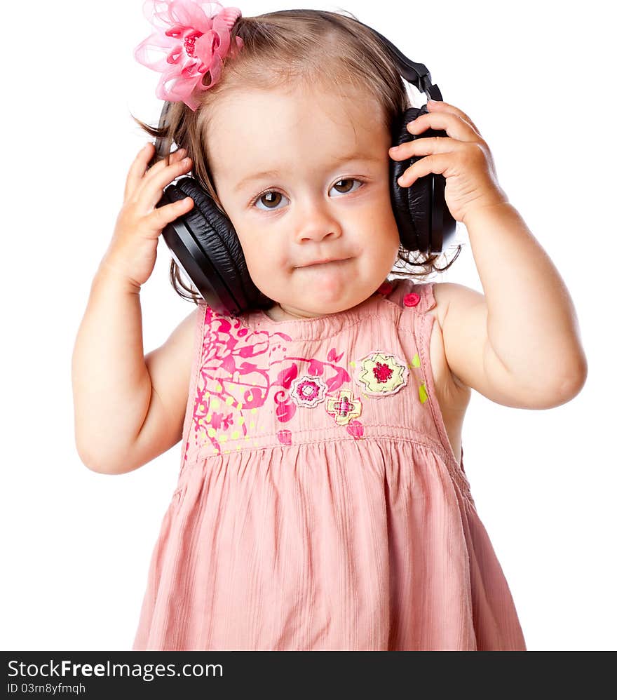 Little girl with headphones. Isolated on white background