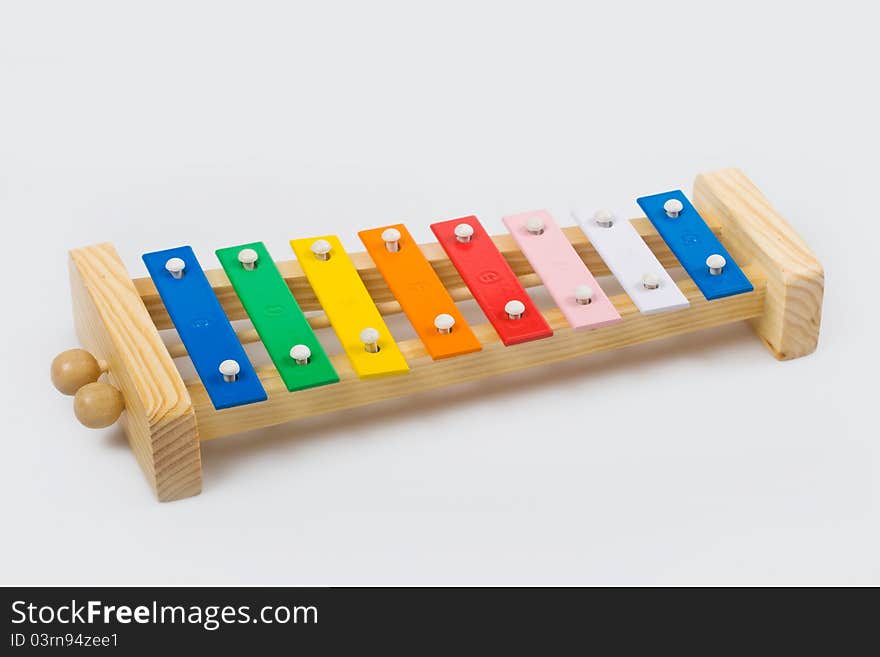 Wooden xylophone on a white background