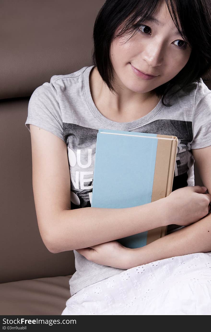 Thinking Beautiful Girl With The Book