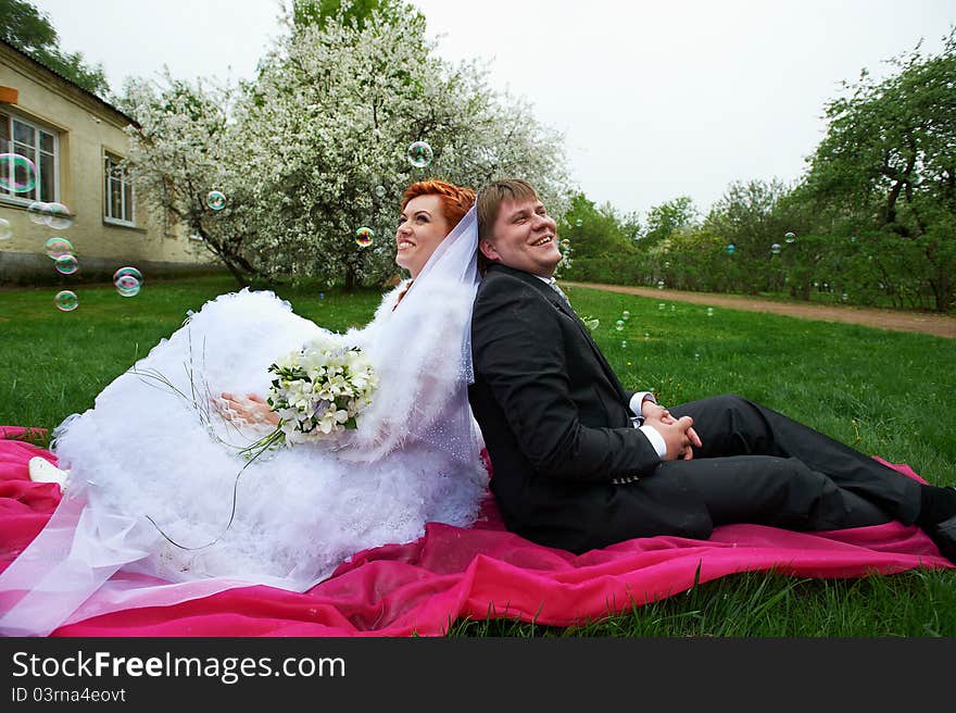 Happy bride and groom in garden