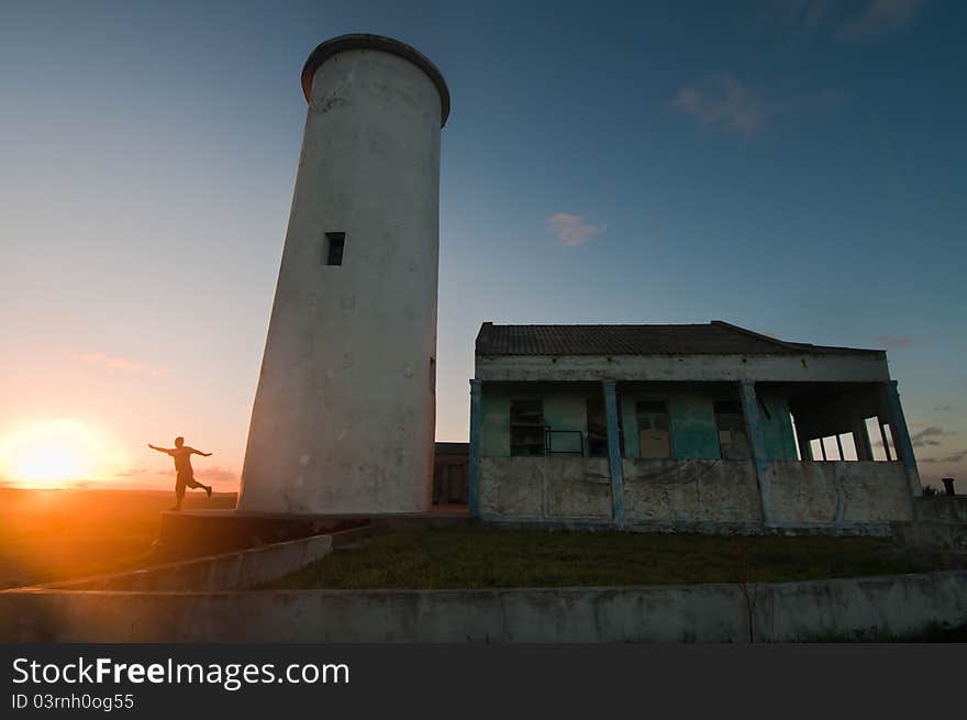 View of someone next to a lighthouse during sunset, Mozambique