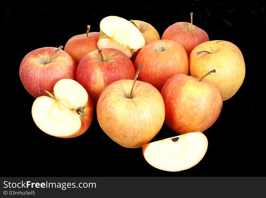 Fresh red apples isolated over black background