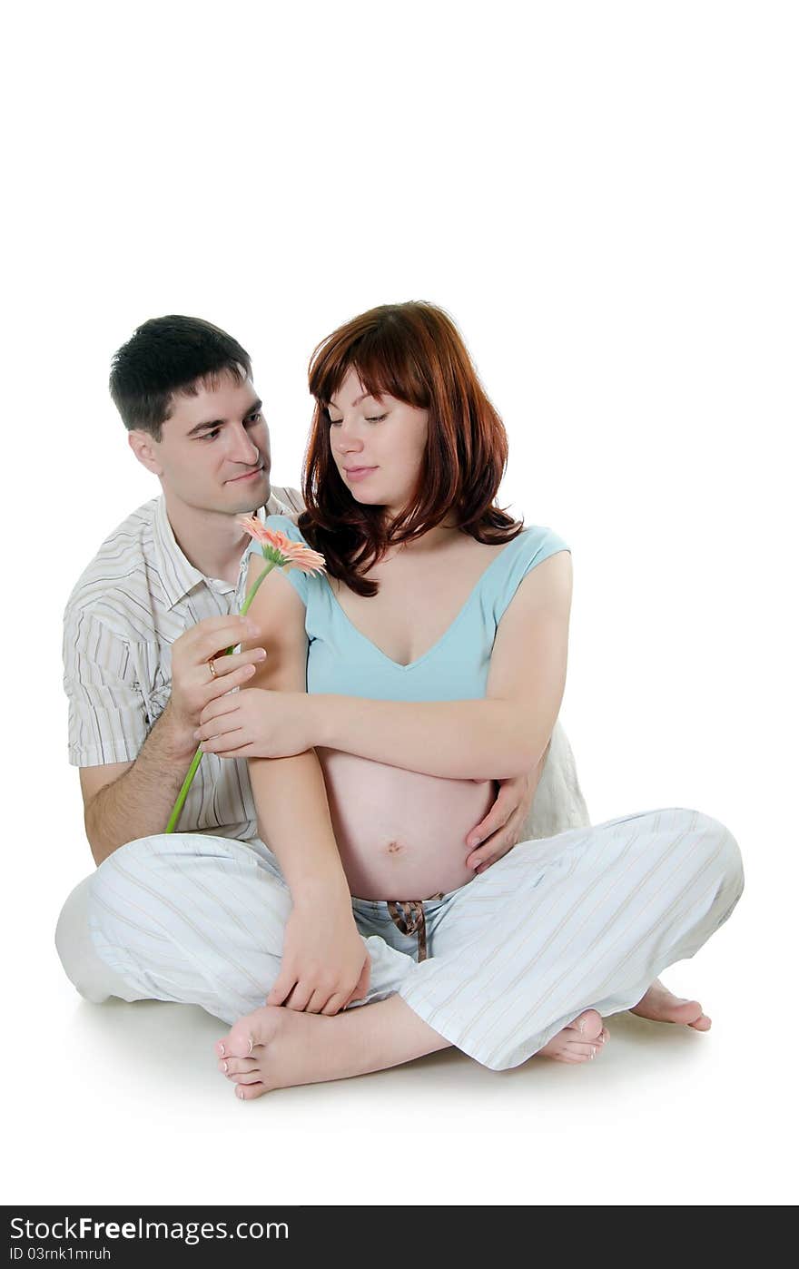 Happy pregnant couple on white background