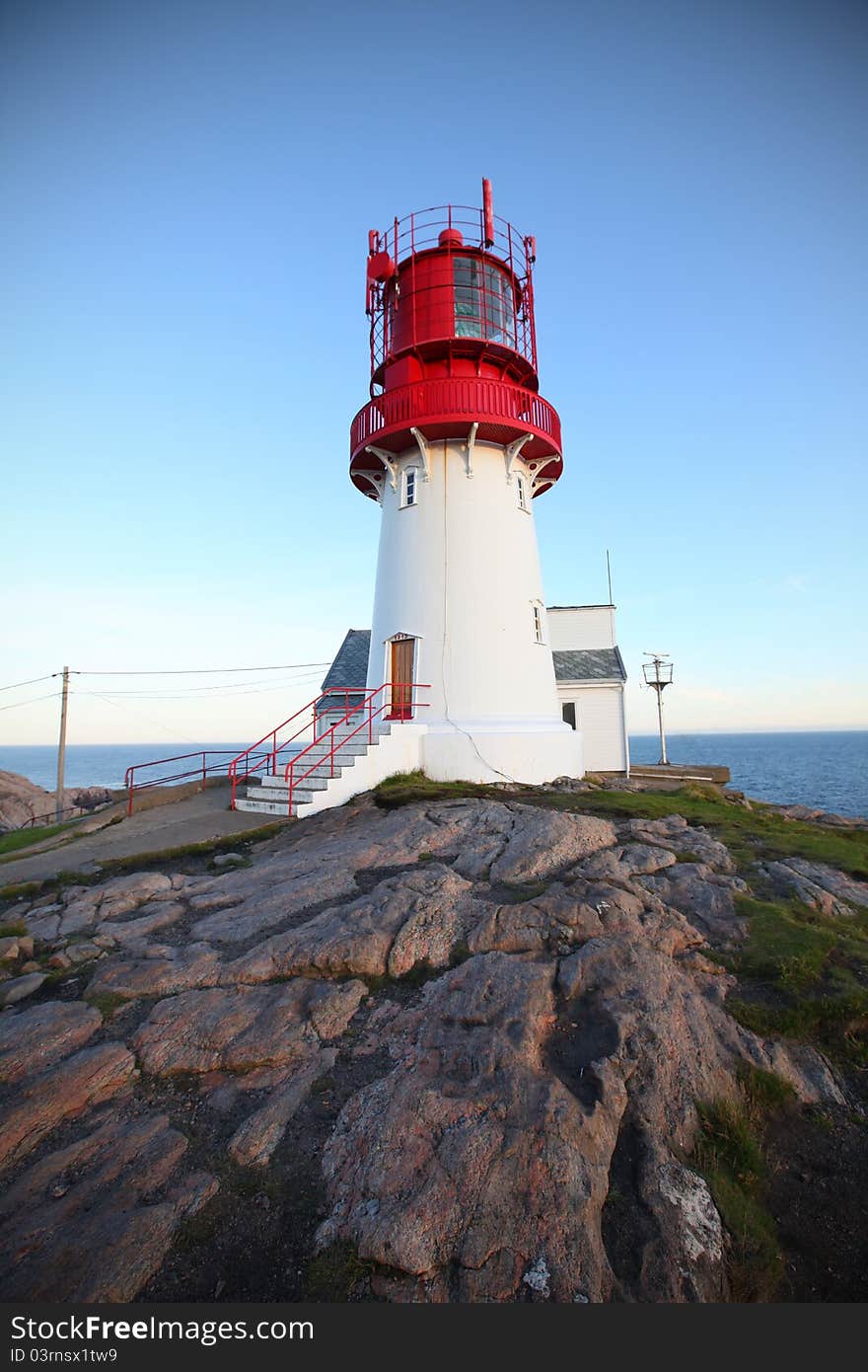 Lighthouse on the rocky hill, southernmost tip of Norway.